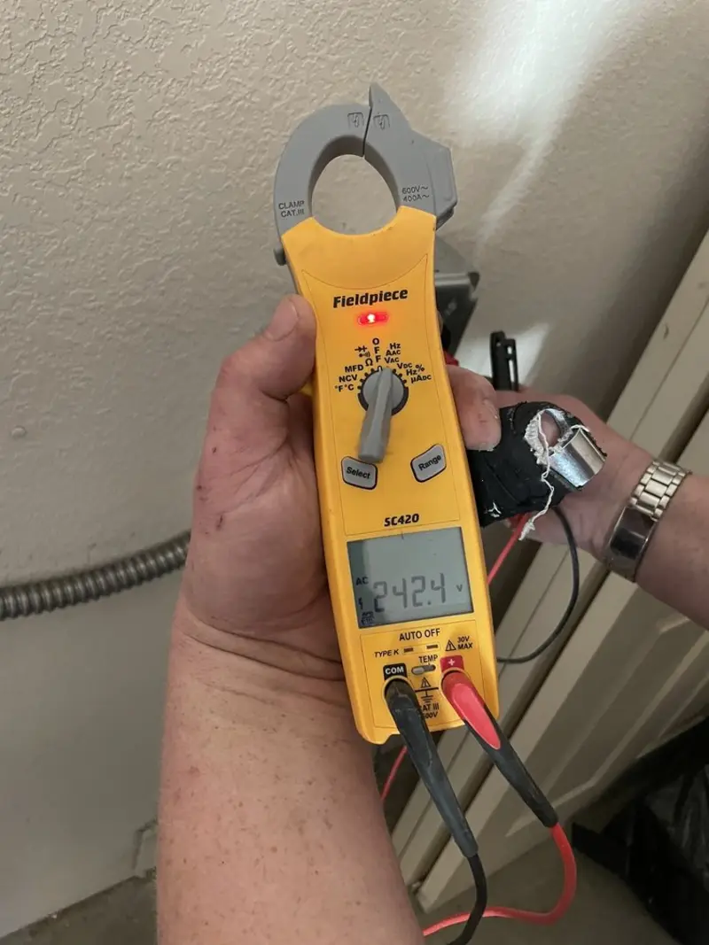Voltage testing with clamp meter during Outlet Installation in Staples